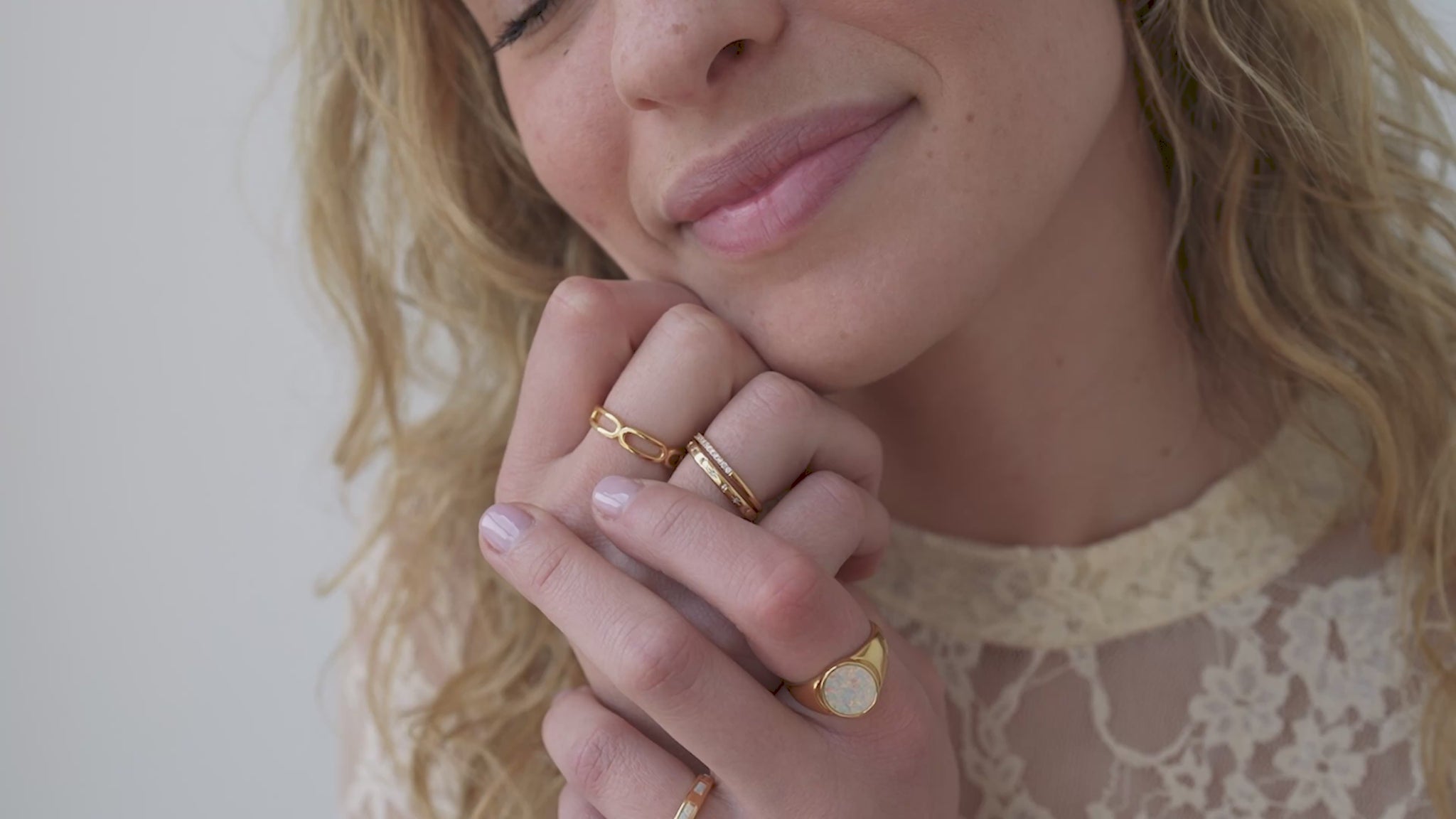 JaxKelly's Inset baguette Ring in White Opal and other JaxKelly ring styles on a model.
