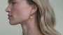 JaxKelly's Seashell Hoop earrings on a model.