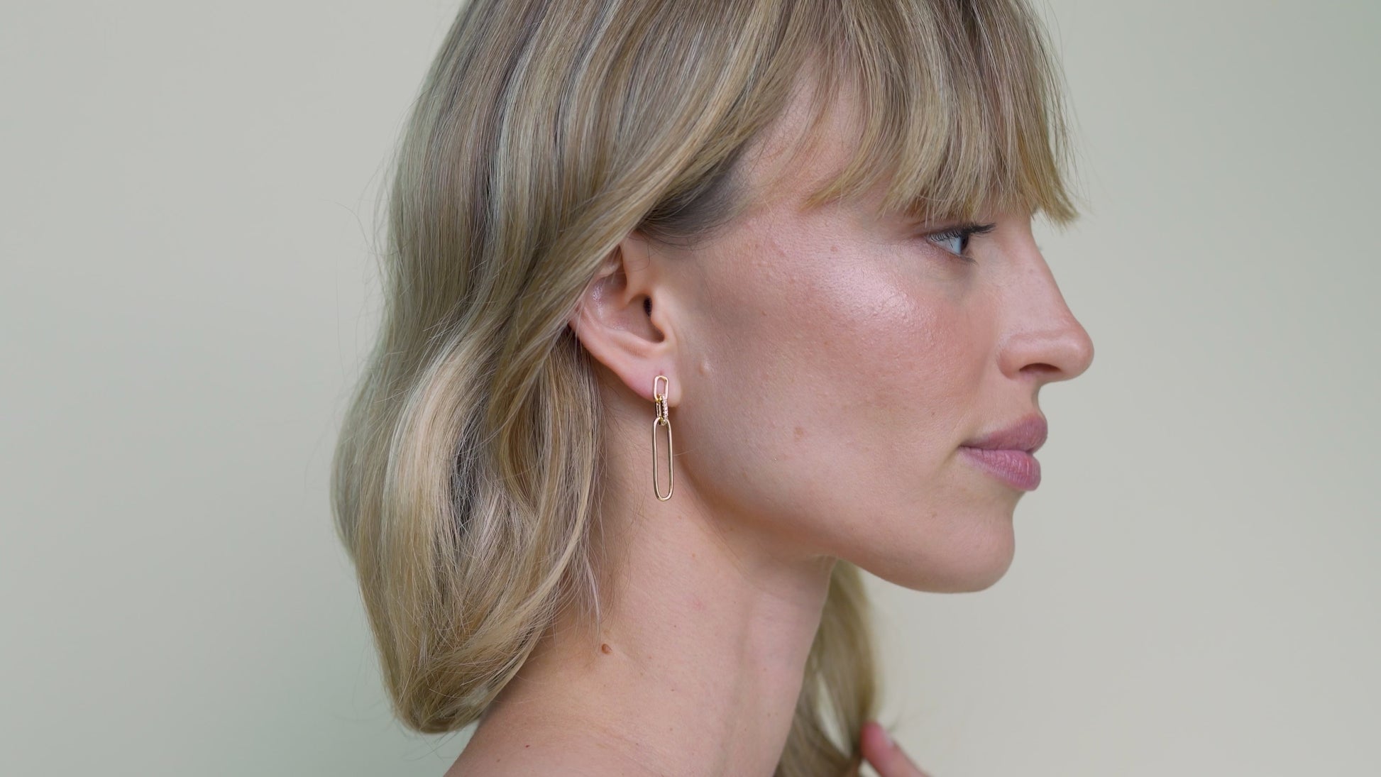 JaxKelly's Pave Link Drop Earrings on a model.