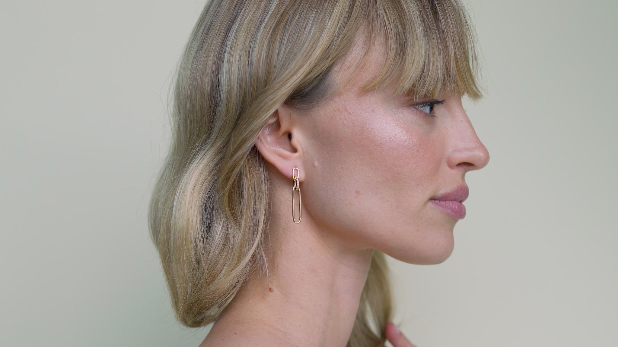 JaxKelly's Pave Link Drop Earrings on a model.