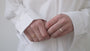 JaxKelly's Champagne Arched Crown Ring and other JaxKelly ring styles on a model's hand.