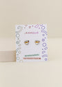 A pair of Ramen Enamel Flat Back Kids Earrings is displayed on a white JaxKelly card with colorful geometric doodles, noting the hypoallergenic earrings feature kid-friendly posts.