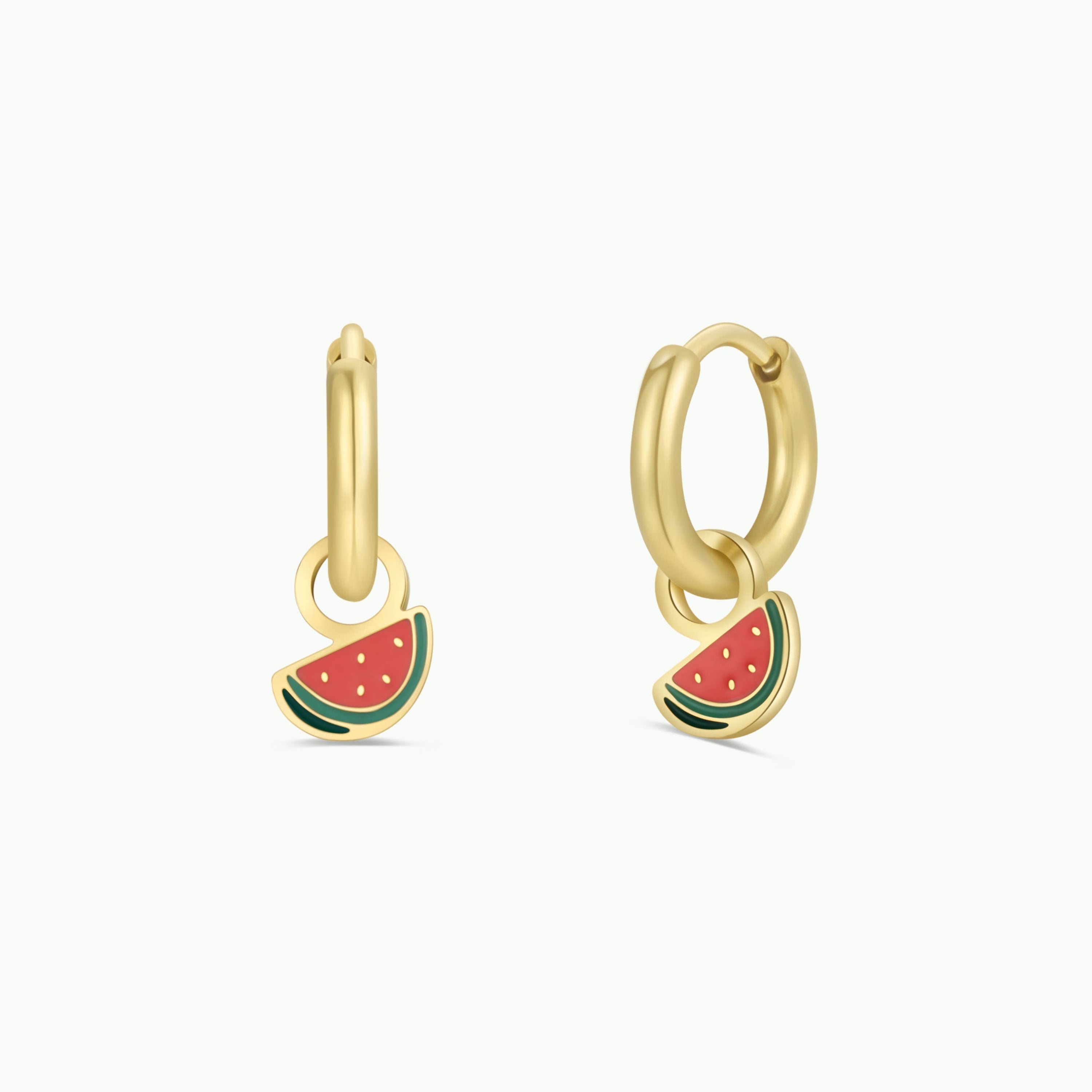 The Watermelon Enamel Charm Hoop is a pair of gold hypoallergenic earrings, each with a small watermelon slice charm in red, green, and black. Great for kids or sensitive ears. Shown on a plain white background.