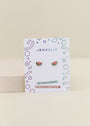 Watermelon Enamel Flat Back Kids Earrings are shown on a white JaxKelly card with colorful geometric designs, labeled “Hypoallergenic” and “Kid-Friendly Posts.”.
