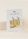 The Large Ball Hoop earrings are gold plated with sterling silver posts and beaded details, displayed on a white JAXKELLY card labeled "wear good vibes" against a neutral background.