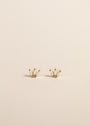 The White Opal Crown Stud features three lab-grown marquise opals in a fan-shaped gold plated setting, pictured on a plain light beige background.