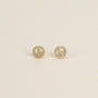 A pair of small, round 18k gold plated Pavé Peace Sign stud earrings with clear CZ stones, displayed on a plain light background.