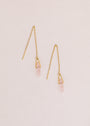 The JaxKelly Gemstone Threader - Rose Quartz features delicate gold plated threader earrings with rose quartz gemstone points, shown on a light beige background.