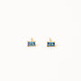 Sapphire Baguette: small, rectangular blue stud earrings set in gold, shown against a plain white background.