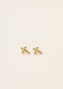 A pair of Cross Stud earrings, small 18k gold plated studs with sterling silver posts shaped like jacks game pieces, shown on a plain light background.