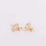 The Mother of Pearl Evil Eye Drop earrings feature marquise-shaped gold studs with a central white pearl, surrounded by tiny CZ stones, and a dangling pearl below each earring, displayed on a white background.