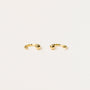 The Gold Sphere Huggie is a pair of small, open gold hoops each featuring a single round bead at one end, shown on a plain white background.