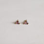 A pair of Amethyst Mini Energy Gems - Healing: small gold stud earrings with triangular purple gemstones and sterling silver posts, shown on a plain light background.