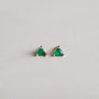 A pair of Green Onyx Mini Energy Gems - Abundance, featuring green onyx triangular stones set in 18k gold plated studs, displayed on a plain light surface.