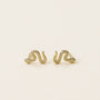 Pavé Snake gold plated earrings, shaped like elegant serpents and adorned with sparkling CZ stones, shown on a simple light background.