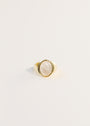 The Mother of Pearl Signet Ring features a large oval mother of pearl gemstone set at the center, shown against a plain white background.