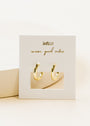 The Small Rectangular Hoop, featuring gold hoops and sterling silver posts, is displayed on a white card with "JAXKELLY" and "wear good vibes" in gold script, set upright against a neutral background.