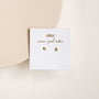 The Tiny Star mini stud earrings feature sterling silver posts and an 18k gold-plated finish, displayed on a white card with gold "JAXKELLY" and "wear good vibes" text, set against a neutral background.