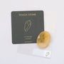 A Citrine Touch Stone rests beside a dark gray card labeled "Touch Stone" with a gold gemstone outline, the phrase "Citrine Success," and a small website link, all displayed on a white background.